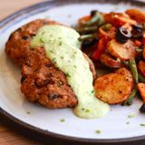 Tuna and olive burger with charred lemon and herb sauce